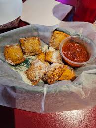 Milo’s Tavern signature dishes Toasted RavioliHot Chicken WingFlorentine